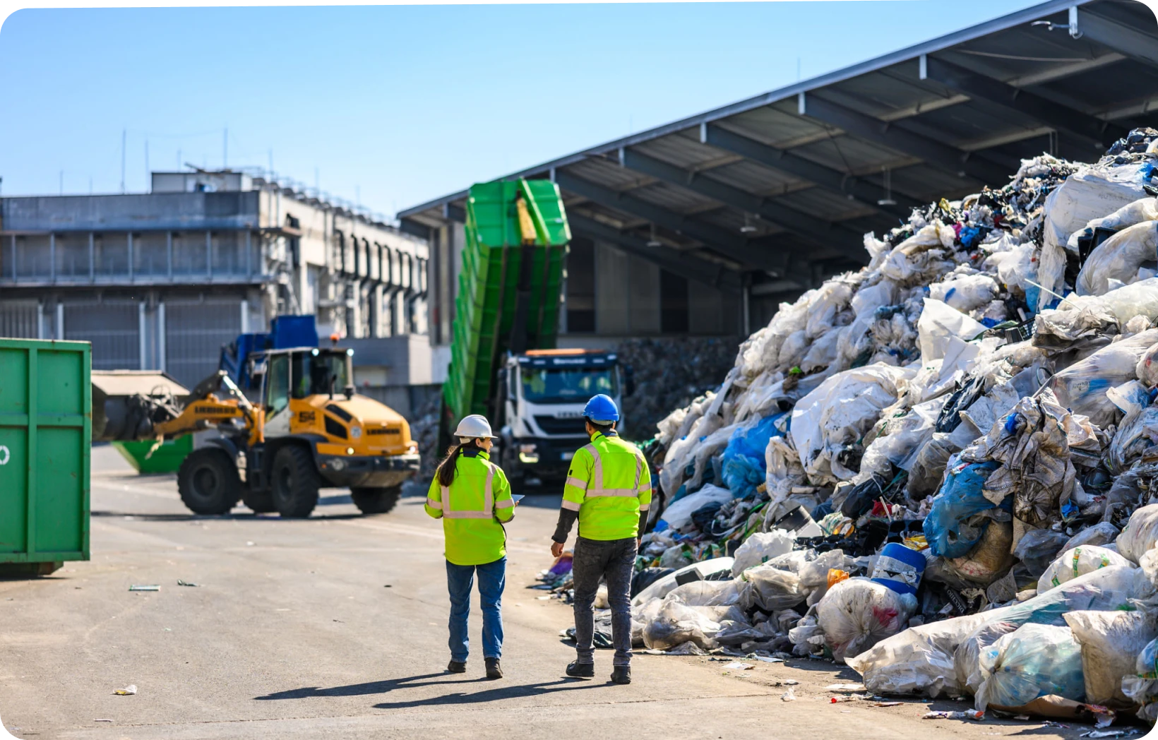 Bulldozer moving waste in a landfill