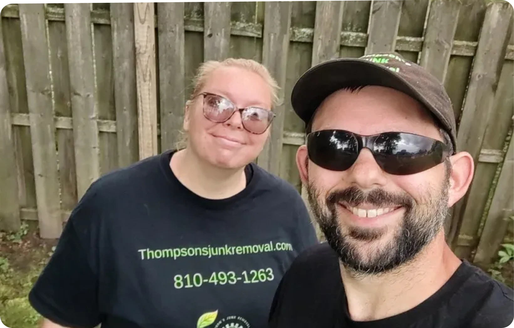 Man and woman posing outdoors